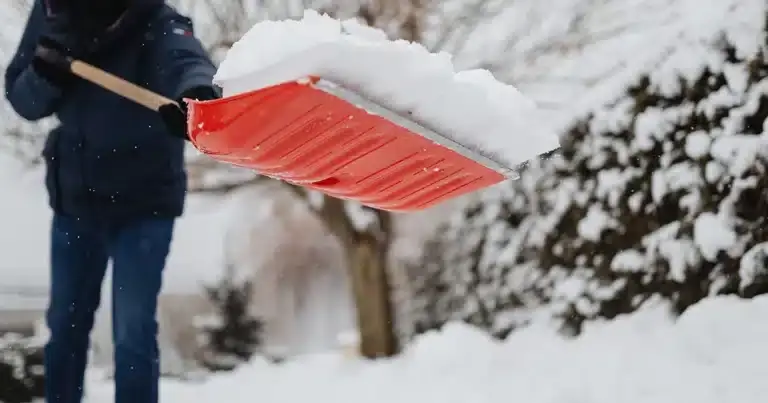 Business Owner shoveling sidewalk